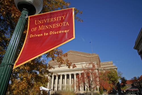 "Driven to Discover" flag outside of Northrop Auditorium